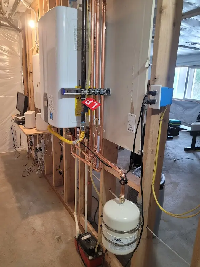 Licensed plumber repairing a kitchen sink in Oxford